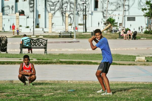 Baseball in the park in Cuba two boys play