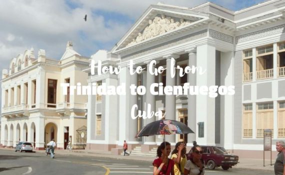 People walking in front of university building in CIenfuegos